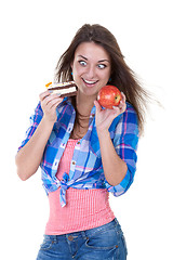 Image showing Portrait of a girl with an apple and a cake