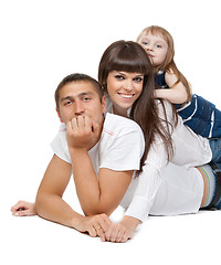 Image showing Happy family looking at the camera on their floor