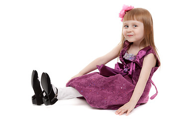 Image showing Four-year girl sitting on white floor