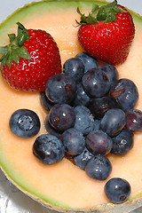 Image showing cantaloupe, blueberries and strawberries