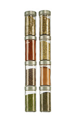 Image showing colorful powder spices in glass bottle