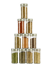 Image showing colorful powder spices in glass bottle