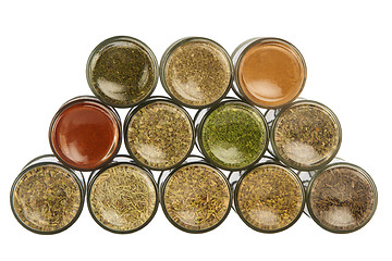 Image showing colorful powder spices in glass bottle