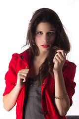 Image showing Pretty young woman with red jacket