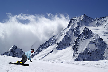 Image showing Snowboarder on piste slope