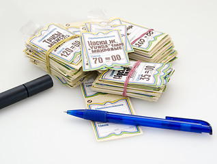 Image showing A heap of price-tags, pen and marker