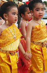 Image showing Young Thai girls in traditional dress participate in a parade