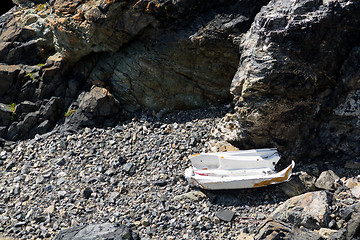 Image showing Smashed boat on rocky beach