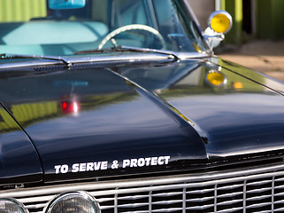 Image showing Vintage police car detail on hood 