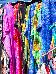 Image showing Clothing and fabrics in street market stall