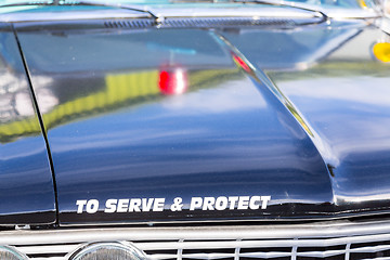 Image showing Vintage police car detail on hood 