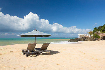 Image showing Reclining chairs and umbrella on Baie Rouge