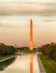 Image showing Setting sun on Washington monument reflecting