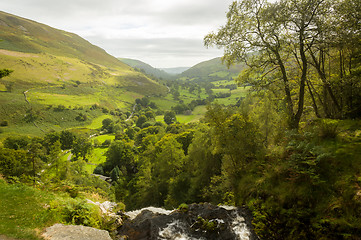 Image showing View down valley from top of Pistyll Rhaeadr waterfall near Llan