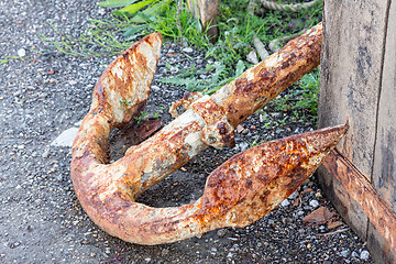 Image showing Old rusty anchor on dockside