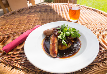 Image showing Sausage and mash with gravy in english pub