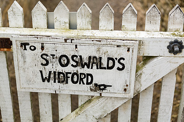 Image showing Signpost for footpath to St Oswalds church