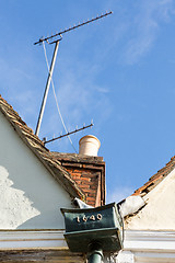 Image showing Contrast between old and new on roof