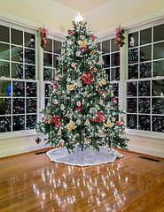 Image showing Christmas tree at night in modern room