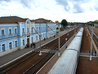 Image showing building of railway station and the top of train