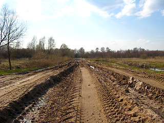 Image showing Rural road with greater traces of cars and a dirt