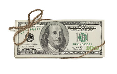 Image showing Stack of One Hundred Dollar Bills Tied in a Burlap String on Whi