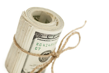 Image showing Roll of One Hundred Dollar Bills Tied in Burlap String on White