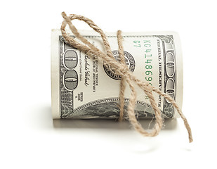 Image showing Roll of One Hundred Dollar Bills Tied in Burlap String on White