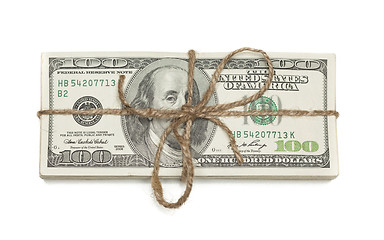 Image showing Stack of One Hundred Dollar Bills Tied in a Burlap String on Whi