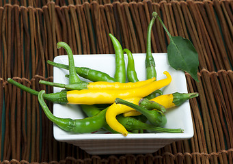 Image showing Small thin green chili peppers