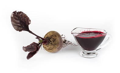 Image showing Red beets with leaves and jug with juice