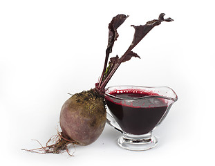 Image showing Red beets with leaves and jug with juice