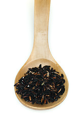 Image showing Black rice in wooden spoon