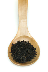 Image showing Wild black rice in wooden spoon