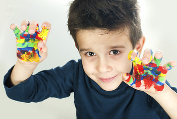 Image showing Boy hands painted with colorful paint