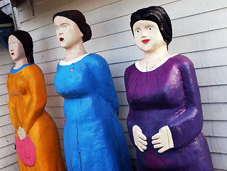 Image showing Three female statues in bright clothing