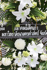 Image showing Flowers left by mourners