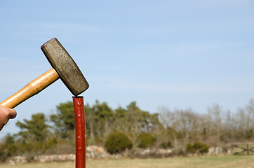 Image showing Hammering a pole