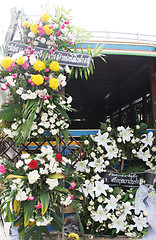 Image showing A truck decorated with flowers at the funeral of Phuket's matria