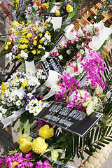 Image showing Flowers left by mourners