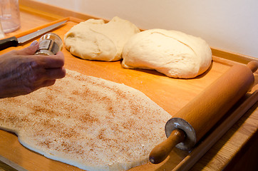 Image showing Baking cinnamon buns