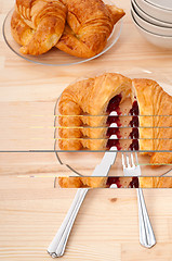 Image showing croissant French brioche filled with berries jam