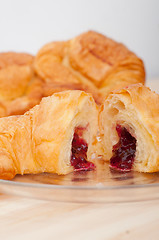 Image showing croissant French brioche filled with berries jam