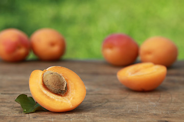 Image showing Apricots on a wooden table