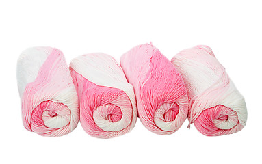 Image showing Skeins of white and pink thread.