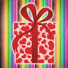 Image showing Rainbow background with gift box and red bow. 