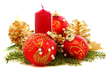 Image showing Christmas balls, candles and pine cones.