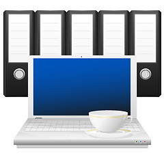 Image showing Laptop with cup and binders.