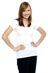 Image showing Attractive teenager posing casually, hands on waist