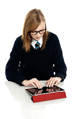 Image showing Bright teen student using a tablet device